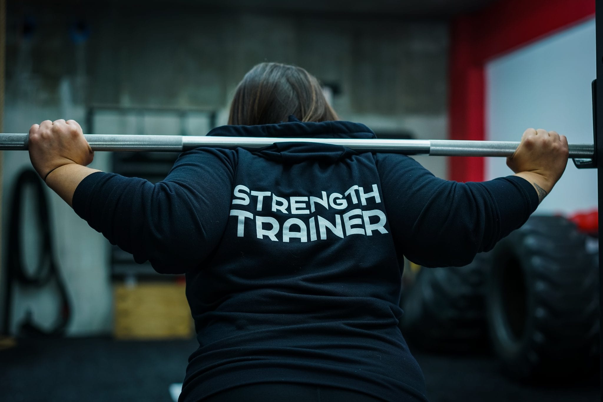 Barbell placement for a low bar squat